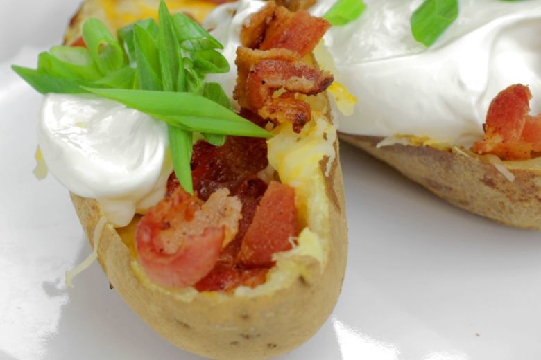 Michigan Loaded Potato Skins with garnish on plate