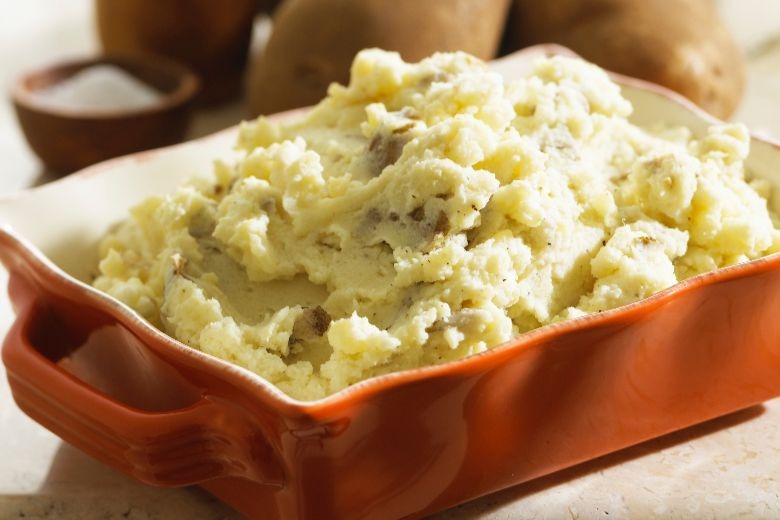 Positively Perfect Mashed Potatoes in casserole dish