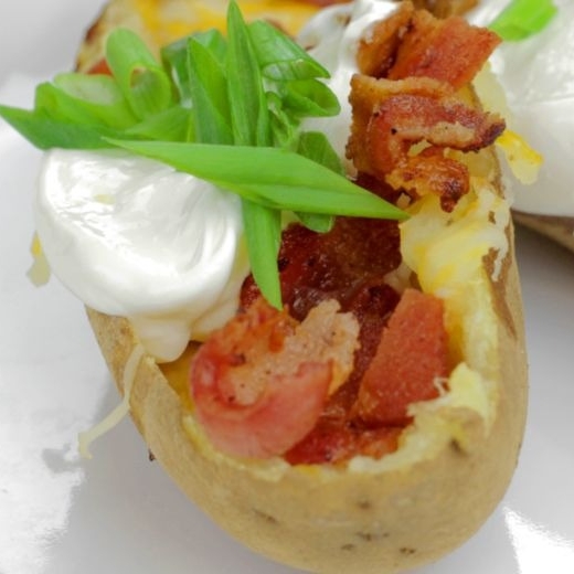 Michigan Loaded Potato Skins with garnish on plate